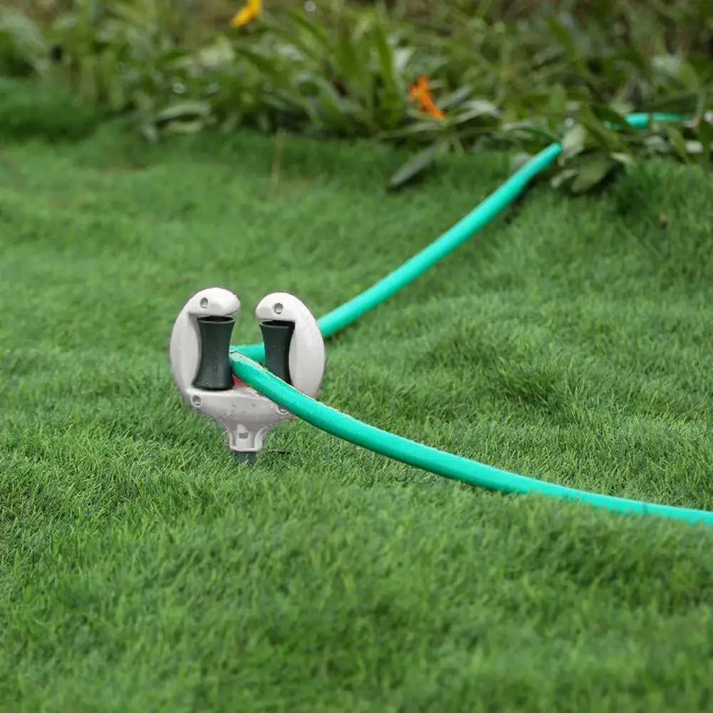 Guía de manguera de jardín en metal